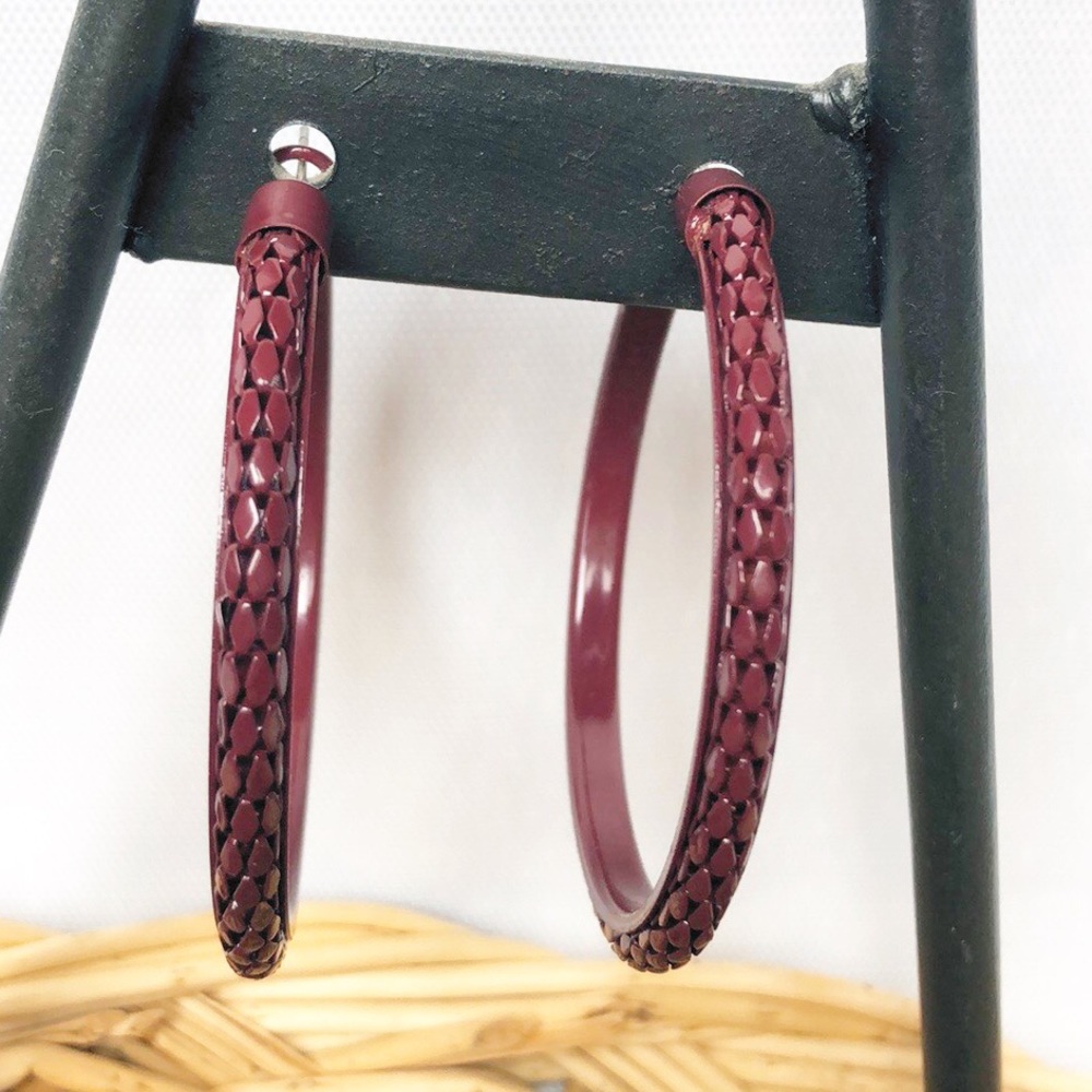 Large plum colored textured hoop earrings